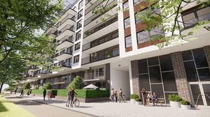 Modern flerbostadshus med balkonger, grönska och människor vid entrén