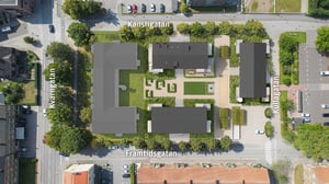 Flygvy över bostadskvarter med byggnader, innergård och gatorna Kansligatan, Framtidsgatan, Kivgatan och Kullagatan