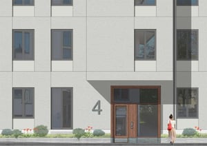 Modern fasad och entré, en kvinna går förbi huset
