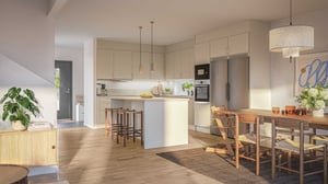radhus med öppen planlösning, modernt kök och matplats i ljusa neutrala färger