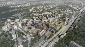 Flygvy över Örnsberg med flerfamiljshus, grönytor och väg nära vatten