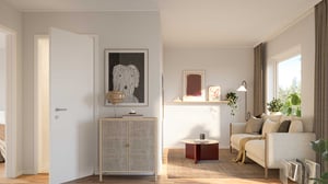 Radhus med stilrent vardagsrum, soffa, ljusa väggar och stora fönster med dagsljus