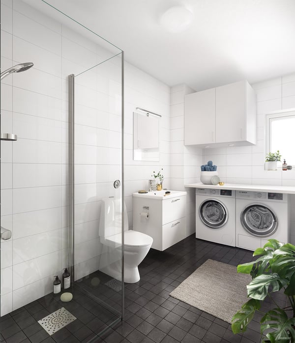 Badrum med dusch, toalett, handfat och tvättmaskin samt torktumlare