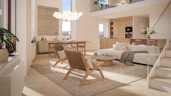 Ljust inrett vardagsrum med matplats och kök i öppen planlösning, vita möbler, trädetaljer och stor matta