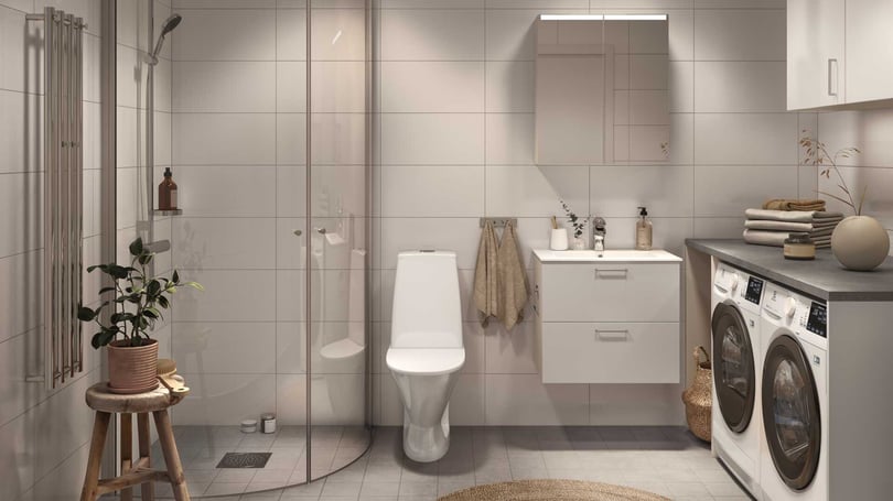 Badrum med duschhörna och tvättmaskin och torktumlare