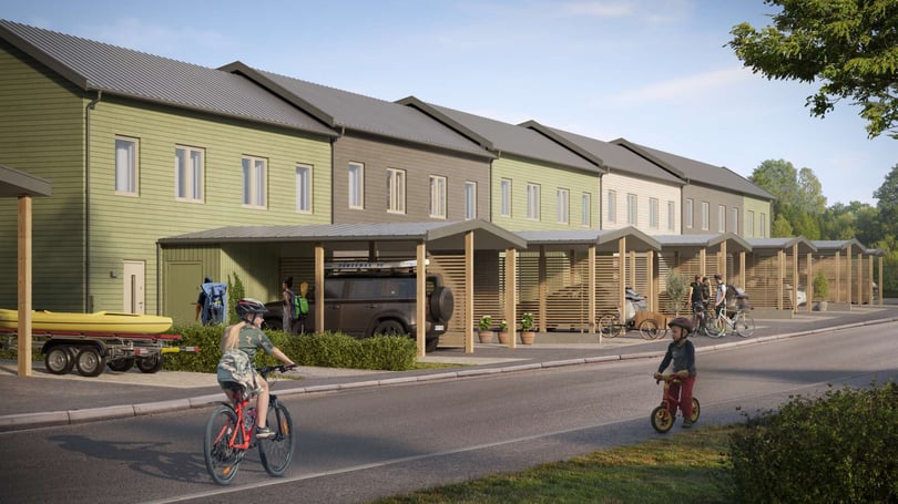 Framsidan av husen med carport