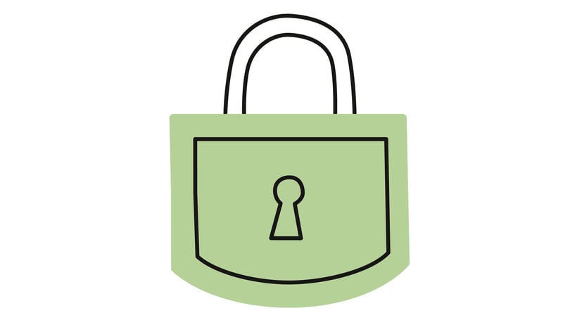 Grön hänglås med nyckelhål i mitten