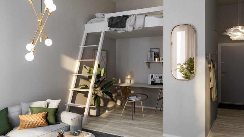 Inredd lägenhet med loftsäng, arbetsplats och soffa i vardagsrum