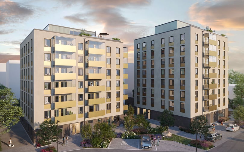 Flerfamiljshus med balkonger och grönytor mellan byggnaderna