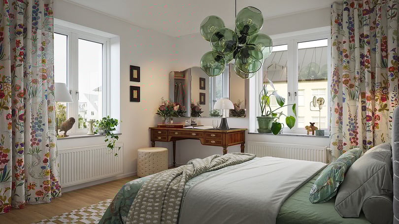 Ljust och stilfullt sovrum med stora fönster, skrivbord, grön glaspendel och blommiga gardiner