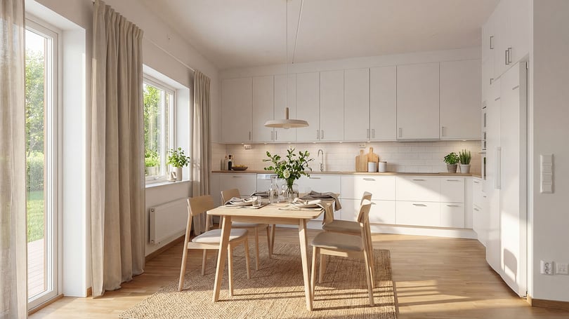 Tomt rum i ljus och modern köksmiljö med matplats, vita skåp och stora fönster