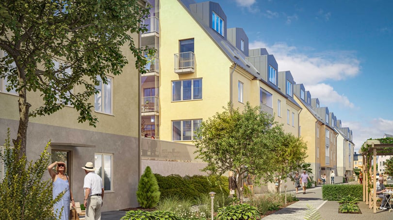 Modernt bostadsområde med flerbostadshus, grönska och människor som promenerar