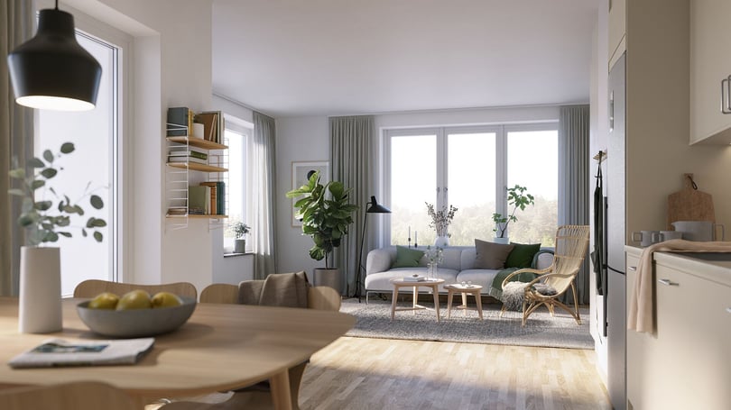 Lägenhet med ljus öppen planlösning, matplats och vardagsrum med soffa, växter och stora fönster