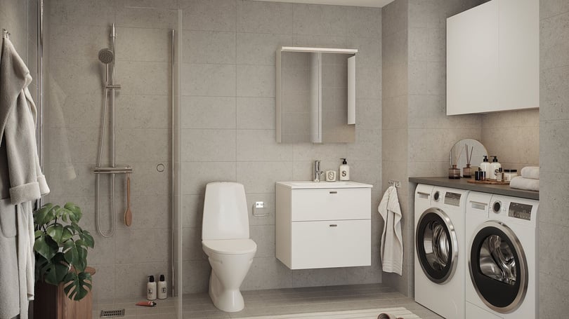 Badrum med dusch, toalett, tvättställ och tvättmaskin samt torktumlare