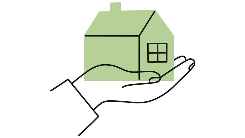 Illustration av ett grönt hus i en hand