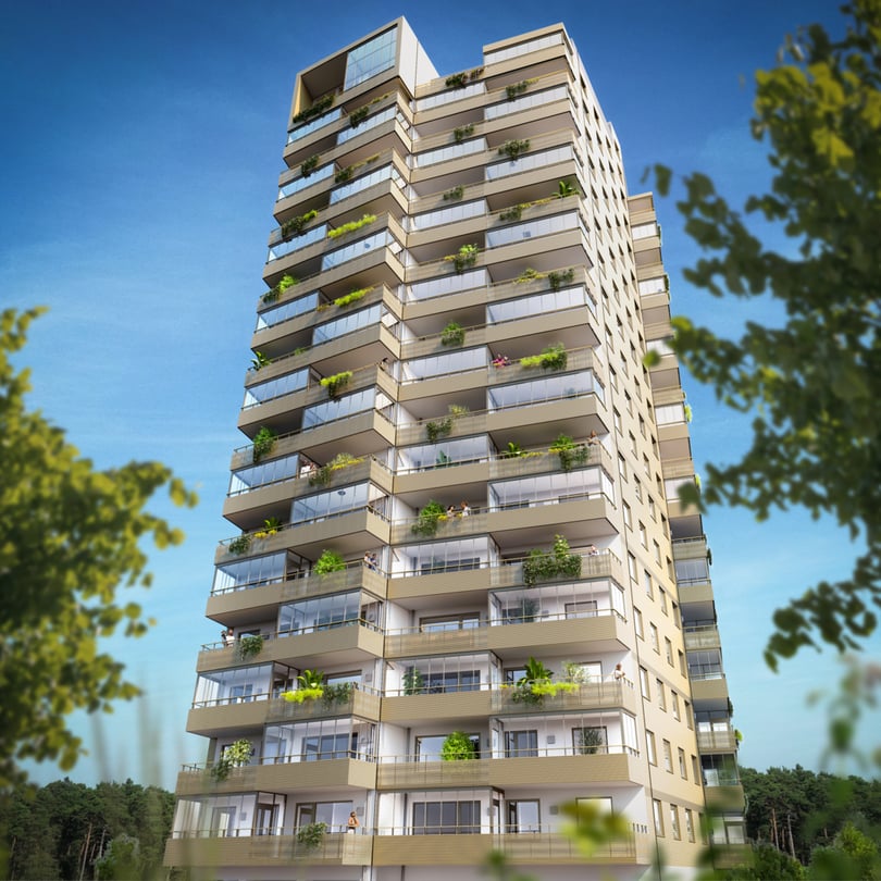 Flerbostadshus med balkonger och gröna växter mot blå himmel