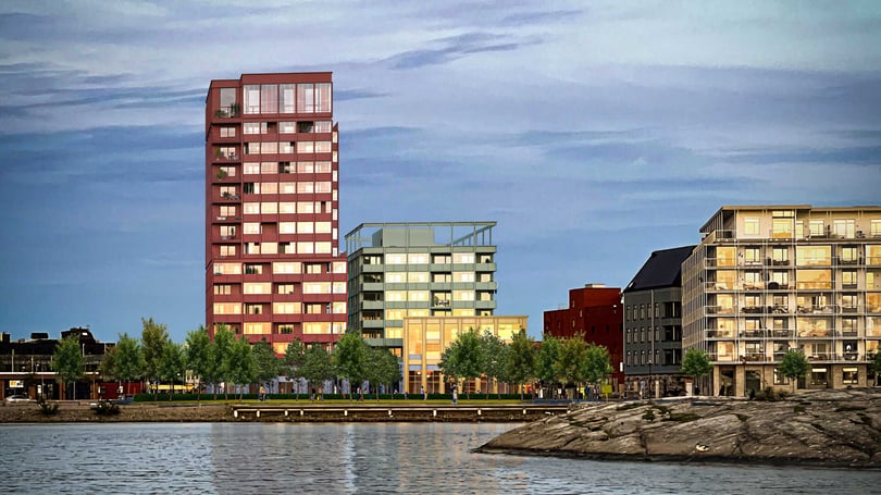 Bostadshus vid havet, i Karlskrona, med moderna lägenheter och grönska på kajen