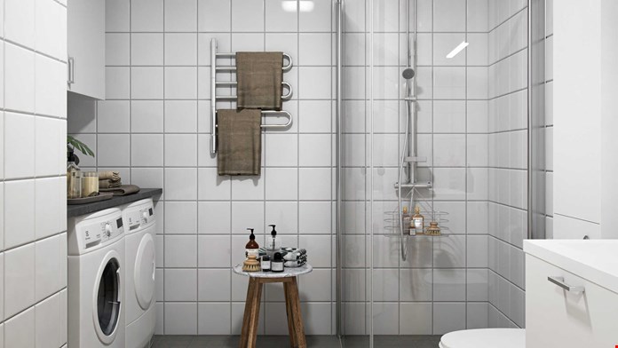 Helkaklat badrum med kommod, spegelskåp, dusch och tvättavdelning