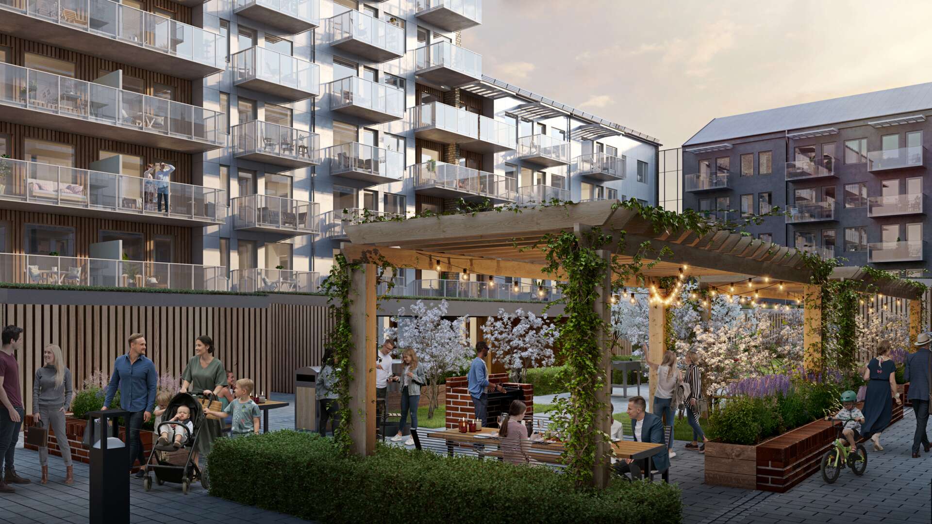 Gemensam mysig innergård med pergola, grill och gott om sittplatser